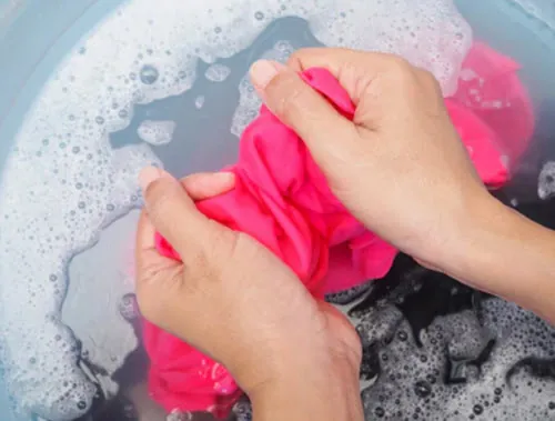 washing clothing with playdough stains