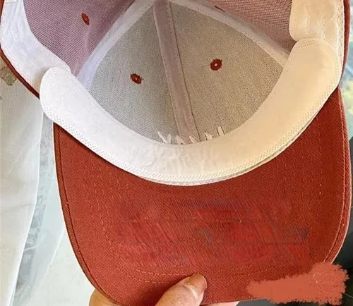 check the hat brim for sweat stains